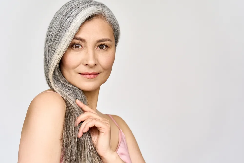 Portrait of gorgeous happy middle aged mature asian woman, senior older 50s lady
