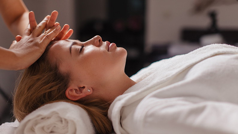 A woman enjoying a professional massage.