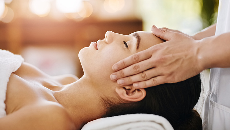 A woman l having a massage in the head.